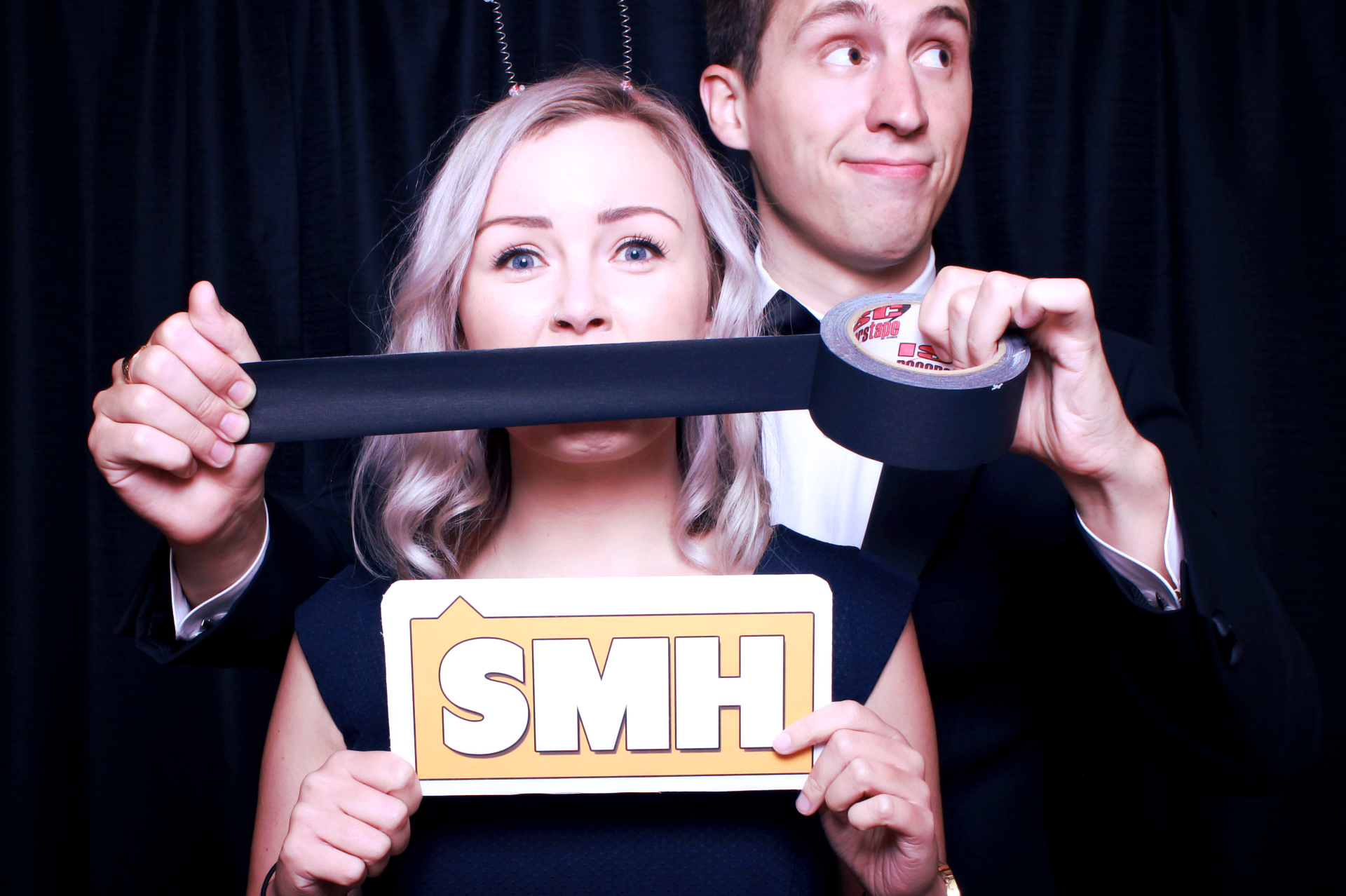 Guests posing at an Instant Photo Box photo booth event
