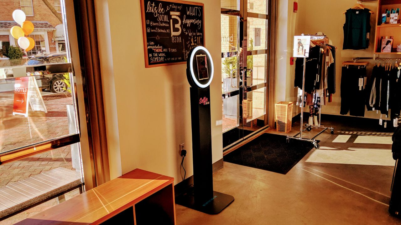 Permanent Instant Photo Box selfie station installed in a barre3 retail studio